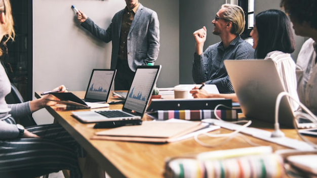 a group of people in a meeting